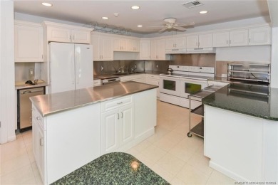 Enjoy the ease of Florida living in this first floor, end unit