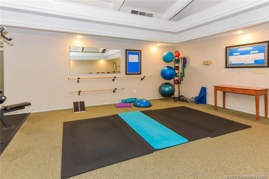 Enjoy the ease of Florida living in this first floor, end unit