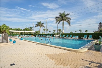 Enjoy the ease of Florida living in this first floor, end unit