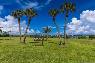 Enjoy the ease of Florida living in this first floor, end unit