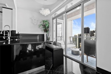 This exceptional 3-bedroom, 4-bath residence at the prestigious