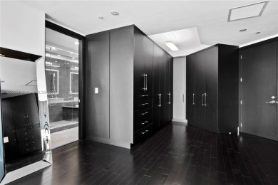 This exceptional 3-bedroom, 4-bath residence at the prestigious