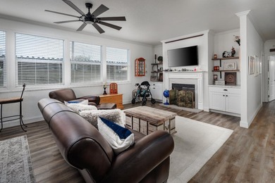 Welcome to this stunning mobile home in a friendly 55+