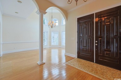 Experience luxury waterfront living in this exquisite all-brick