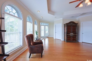 Experience luxury waterfront living in this exquisite all-brick