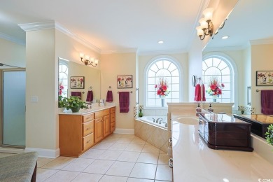 Experience luxury waterfront living in this exquisite all-brick