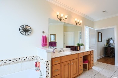 Experience luxury waterfront living in this exquisite all-brick