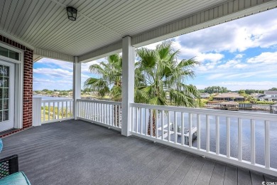 Experience luxury waterfront living in this exquisite all-brick