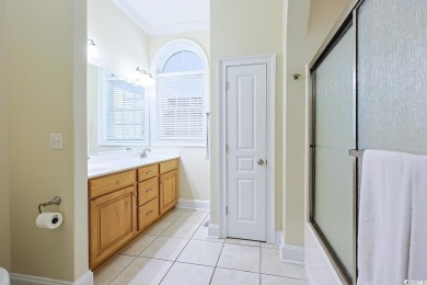 Experience luxury waterfront living in this exquisite all-brick