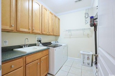 Experience luxury waterfront living in this exquisite all-brick