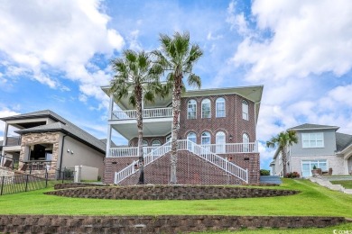 Experience luxury waterfront living in this exquisite all-brick