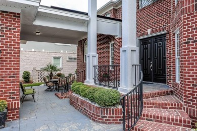 Experience luxury waterfront living in this exquisite all-brick