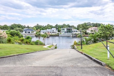 Experience luxury waterfront living in this exquisite all-brick