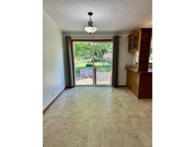 Easy living in the 2 Lake town of Onekama. Home sits on a street