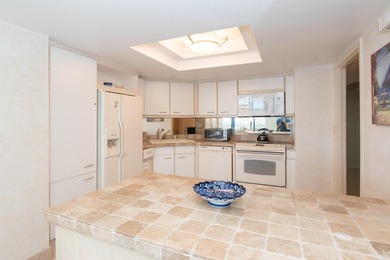 Enjoy a beach styled residence with wrap around views of