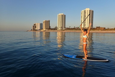 Enjoy a beach styled residence with wrap around views of
