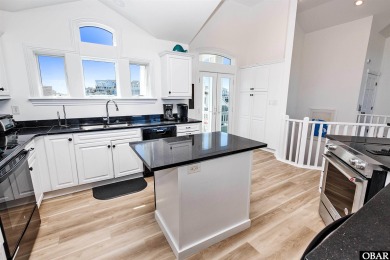 Exceptional oceanfront estate situated on half an acre with over