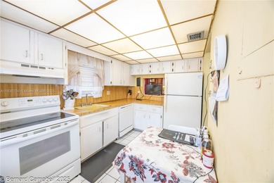 GATED COMMUNITY***First floor Corner Unit condo with lots of