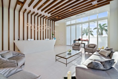 This stunning waterfront British West Indies-style home offers 5