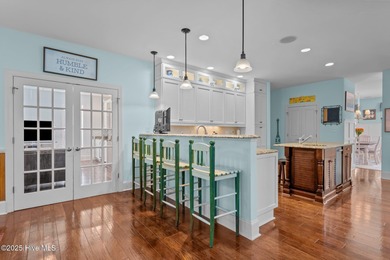 This exceptional 5+ bedroom coastal retreat in the sought-after