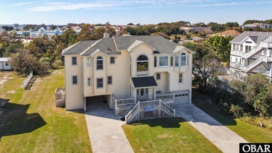 This home, located in Whalehead features a versatile layout