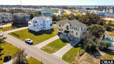 This home, located in Whalehead features a versatile layout