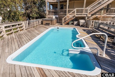 This home, located in Whalehead features a versatile layout