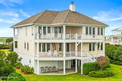 Sweeping views and golden marsh sunsets from this stunning 2014