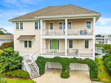 Sweeping views and golden marsh sunsets from this stunning 2014