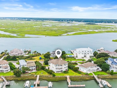 Sweeping views and golden marsh sunsets from this stunning 2014