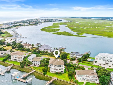 Sweeping views and golden marsh sunsets from this stunning 2014