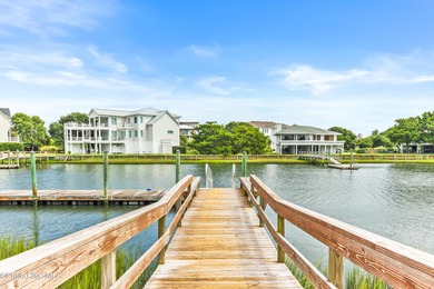 Sweeping views and golden marsh sunsets from this stunning 2014