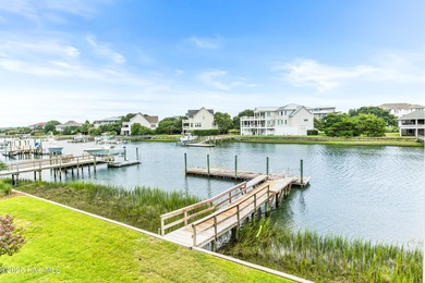 Sweeping views and golden marsh sunsets from this stunning 2014