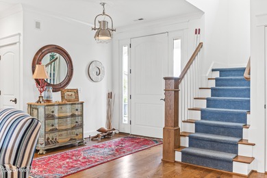 Sweeping views and golden marsh sunsets from this stunning 2014