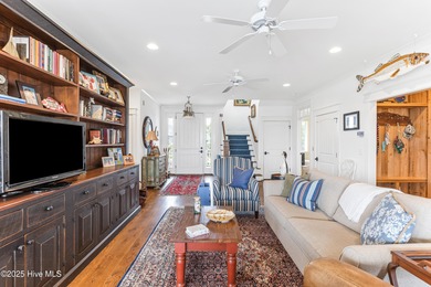 Sweeping views and golden marsh sunsets from this stunning 2014