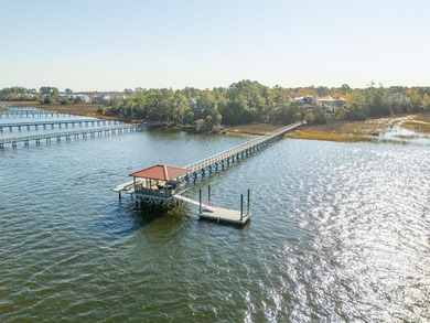 Experience the very best of Charleston waterfront living in this