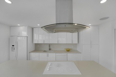 This meticulously renovated 3/2.1 penthouse offers breathtaking