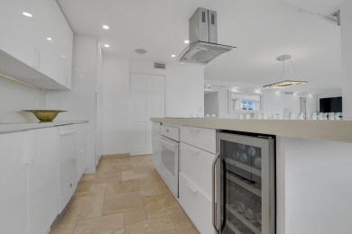 This meticulously renovated 3/2.1 penthouse offers breathtaking