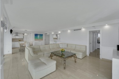 This meticulously renovated 3/2.1 penthouse offers breathtaking