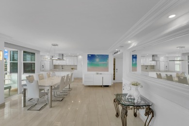 This meticulously renovated 3/2.1 penthouse offers breathtaking