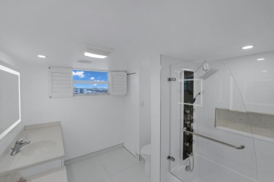 This meticulously renovated 3/2.1 penthouse offers breathtaking