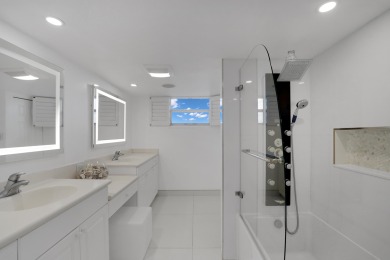 This meticulously renovated 3/2.1 penthouse offers breathtaking