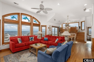 This oceanfront home offers panoramic water views and direct