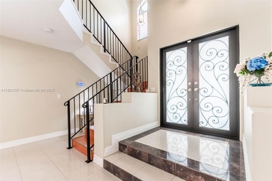 A Home of Distinction! This custom-designed Mediterranean style