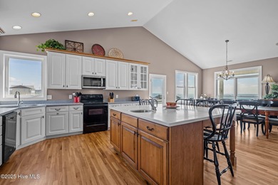 Perched on an elevated lot, this beautiful second-row home