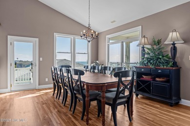 Perched on an elevated lot, this beautiful second-row home