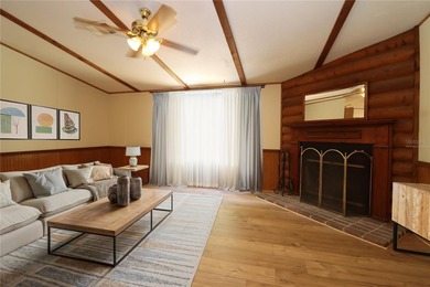 Tucked away on a quiet street sits this cozy half acre lot with