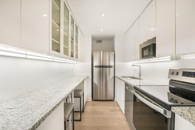 Experience refined city living in this rare A-tier 2 bed / 2