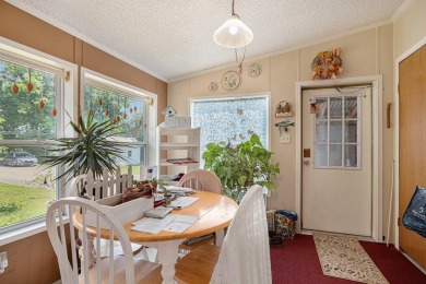 3-bed 2.5-bath ranch with a metal roof on just over an acre of