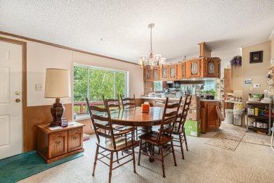 3-bed 2.5-bath ranch with a metal roof on just over an acre of